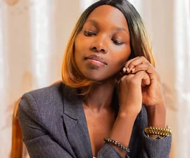 Woman in a blazer in an office setting