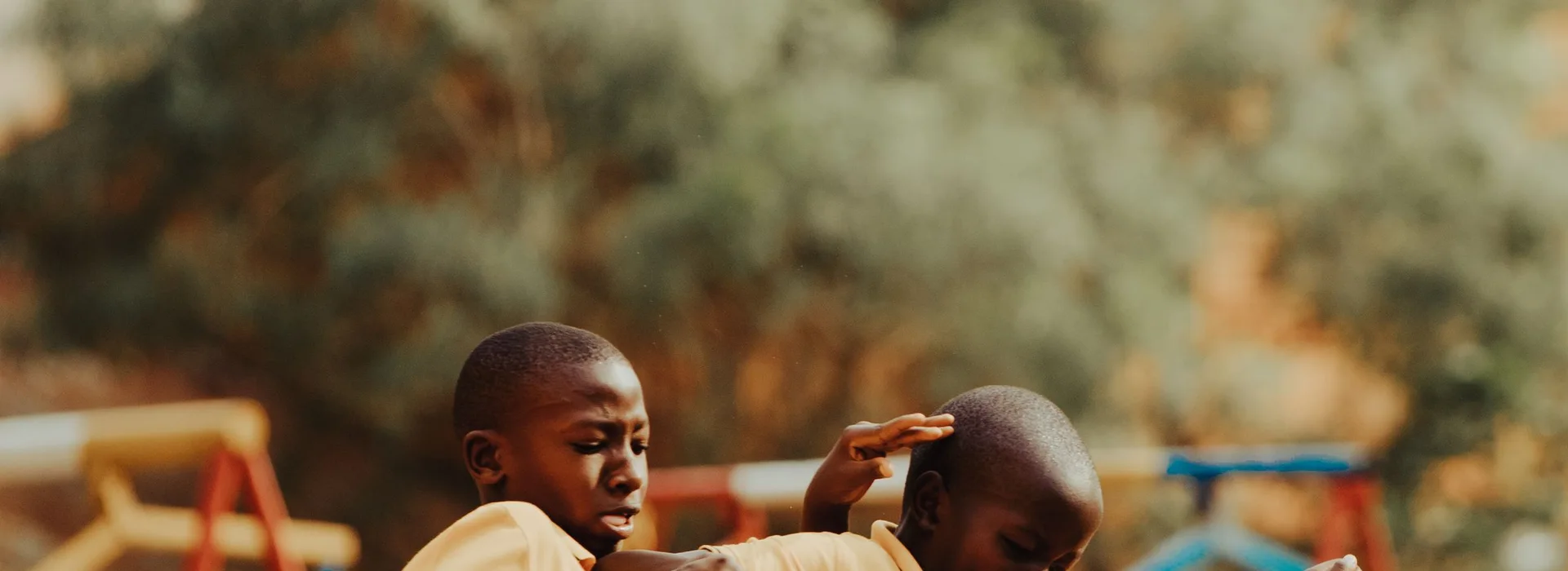 Children playing football in a Kampala schoolyard
