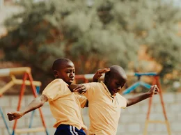 Children playing football in a Kampala schoolyard