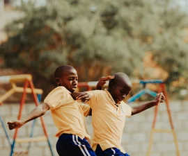 Children playing football in a Kampala schoolyard