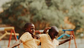 Children playing football in a Kampala schoolyard
