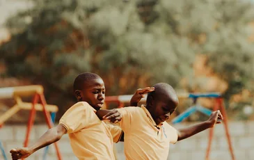 Children playing football in a Kampala schoolyard