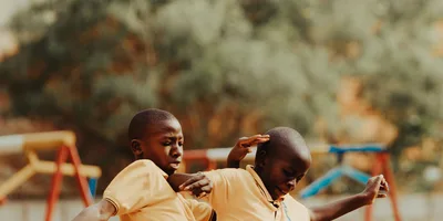 Children playing football in a Kampala schoolyard