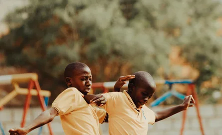 Children playing football in a Kampala schoolyard